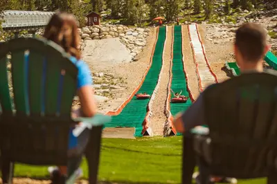 a group of people sitting in chairs looking at a fake track at Zalanta 313 in South Lake Tahoe