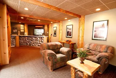 a lobby with two couches and a bar at The Ridge Sierra in Stateline