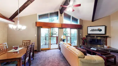 a living room with a couch and a table at Tahoe Chaparral in Incline Village