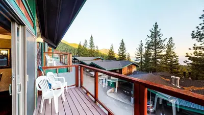 a balcony with chairs and a view of the mountains at Tahoe Chaparral in Incline Village
