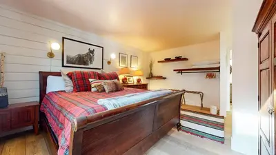 a bedroom with a bed with a wooden frame at Bridges Townhome #5 Condo in Mammoth Lakes