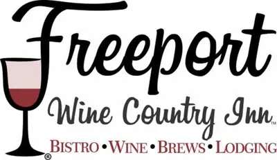 a sign for a wine country with a glass of wine at Freeport Wine Country Inn in Freeport