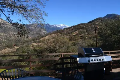 a barbecue grill with a view of the mountains at Shady Knoll in Three Rivers