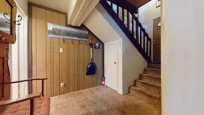 a hallway with stairs in a house at Timberline Condominium #44 in Mammoth Lakes