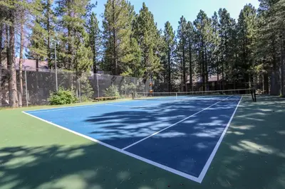 a tennis court with a net on it at Sunshine Village #158 in Mammoth Lakes