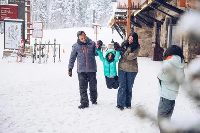 a group of people standing in the snow at 3160 Aspen Grove in Truckee