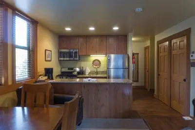 a kitchen with wooden cabinets and a counter top at 3160 Aspen Grove in Truckee