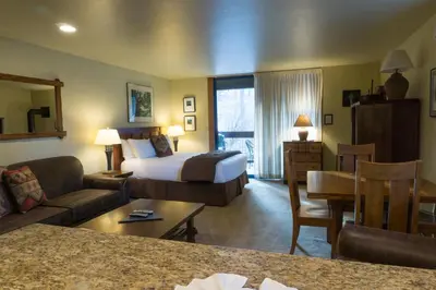 a hotel room with a bed and a living room at 3160 Aspen Grove in Truckee