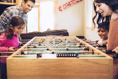 a family playing a game of billiards at 3174 Aspen Grove in Truckee