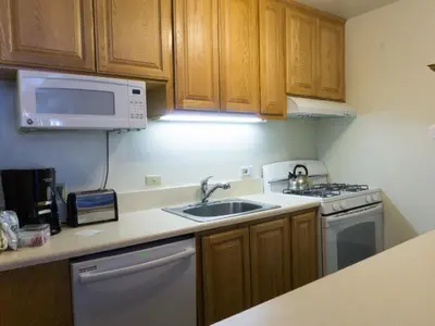 a kitchen with a sink and a microwave at 3174 Aspen Grove in Truckee