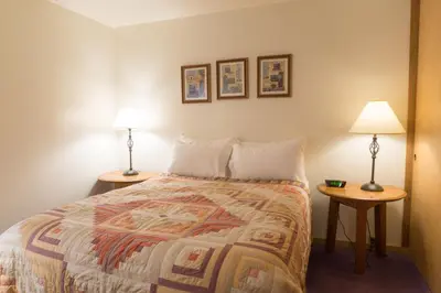 a hotel room with a bed and two lamps at 4025 Ski Trails in Truckee