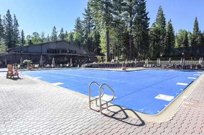 a swimming pool with a blue in front of a building at 4025 Ski Trails in Truckee