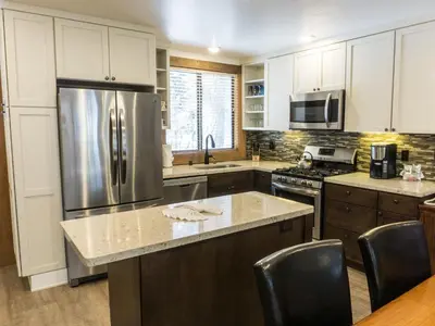 a kitchen with a stainless steel refrigerator and cabinets at 3132 Aspen Grove in Truckee