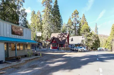 a street in a town with buildings and trees at Sparrow Cove in Shaver Lake