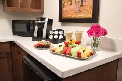 a kitchen counter with a tray of food and a microwave at Jackson Rancheria Casino Resort in Jackson
