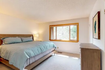 a bedroom with a bed and a window at Sierra Sky in Tahoe City