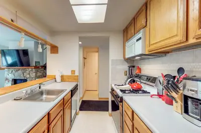 a kitchen with a sink and a stove top oven at Sierra Sky in Tahoe City