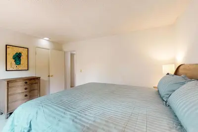 a bedroom with a bed and a wooden dresser at Sierra Sky in Tahoe City