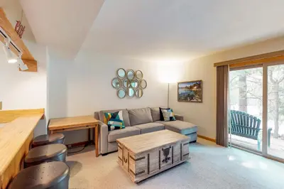 a living room with a couch and a table at Sierra Sky in Tahoe City