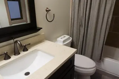 a bathroom with a sink and a toilet and a shower at 3159 Aspen Grove in Truckee