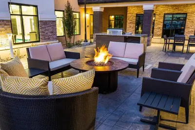 a patio with chairs and a fire pit at Residence Inn by Marriott Reno Sparks in Sparks