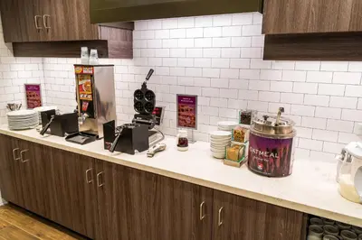 a counter in a kitchen with a counter top with dishes at Residence Inn by Marriott Reno Sparks in Sparks