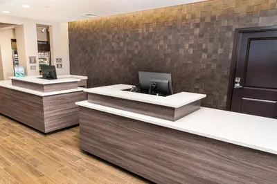 a lobby with two reception desks in a building at Residence Inn by Marriott Reno Sparks in Sparks