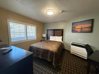 a hotel room with a bed and a desk at Tahoe Sands Inn in South Lake Tahoe