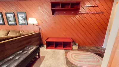 a living room with a couch and a red table at Snowcreek 247 Townhouse in Mammoth Lakes
