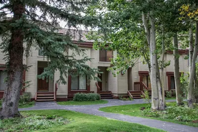 a building with trees in front of it at Snowcreek 247 Townhouse in Mammoth Lakes