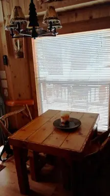 a table with a cup on a plate on it at Cedar Pines Resort in South Lake Tahoe
