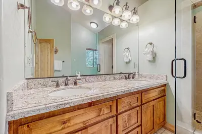 a bathroom with a sink and a mirror at Elegant Pine in South Lake Tahoe