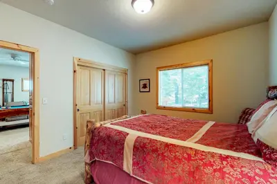 a bedroom with a large bed and a window at Brookstone Haven in Truckee