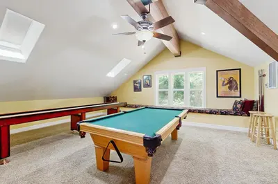 a pool table in a room with a ceiling at Cypress Lodge in Arnold