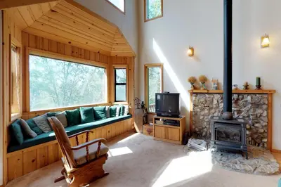 a living room with a couch and a fireplace at The Davis Classic in Arnold