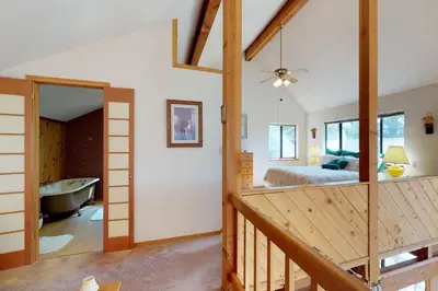 a bedroom with a bed and a tub in a room at The Davis Classic in Arnold