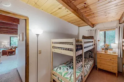 a bedroom with two bunk beds in a house at Mitthas Tapovan in Arnold