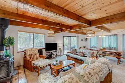 a living room with a couch and a tv at Mitthas Tapovan in Arnold