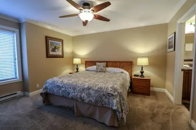 a bedroom with a bed and a ceiling fan at Horizons 4 #165 Condo in Mammoth Lakes