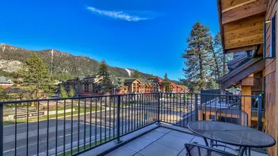 a balcony with a table and chairs and a mountain at Zalanta 319 in South Lake Tahoe