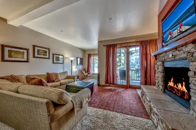 a living room with a couch and a fireplace at R110 Timber Ridge in Kirkwood