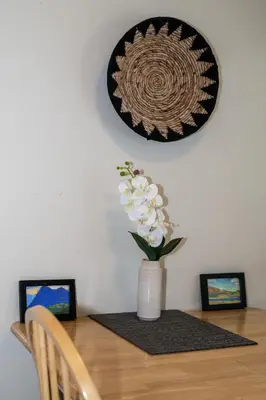 a vase with white flowers on a table at Gull Lake Lodge in June Lake