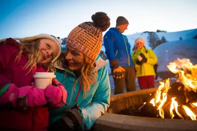 a group of people standing around a fire pit at 3302 Sun Meadows in Kirkwood