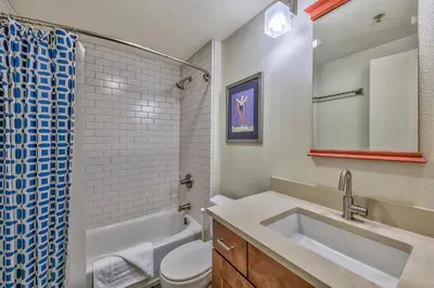 a bathroom with a sink and a toilet and a shower at 3302 Sun Meadows in Kirkwood