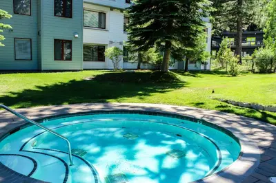 a swimming pool in the yard of a house at Resort at Squaw Creek 808 in Olympic Valley