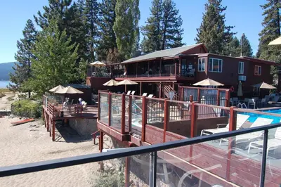 a resort with a swimming pool and a house at Crown Motel in Kings Beach
