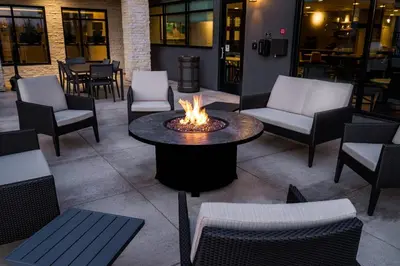 a fire pit in a patio with chairs and a table at Residence Inn by Marriott Rocklin Roseville in Roseville