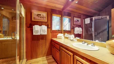 a bathroom with a sink and a shower at Tennis Village 14 Townhouse in Mammoth Lakes
