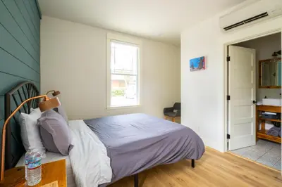a bedroom with a bed and a window at Eastside Guesthouse and Bivy in Bishop