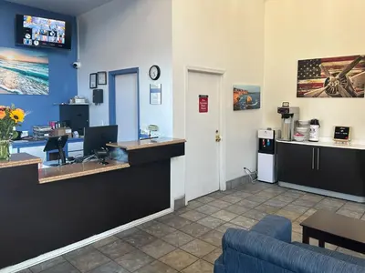 a waiting room with a reception desk in a clinic at Studio 6 Suites Cameron Park, CA Folsom in Cameron Park